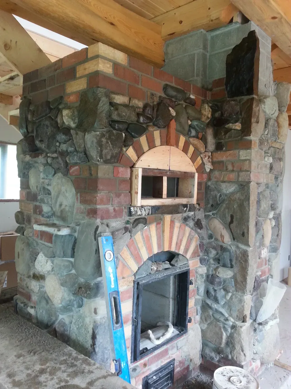 Master craftsman building a masonry heater